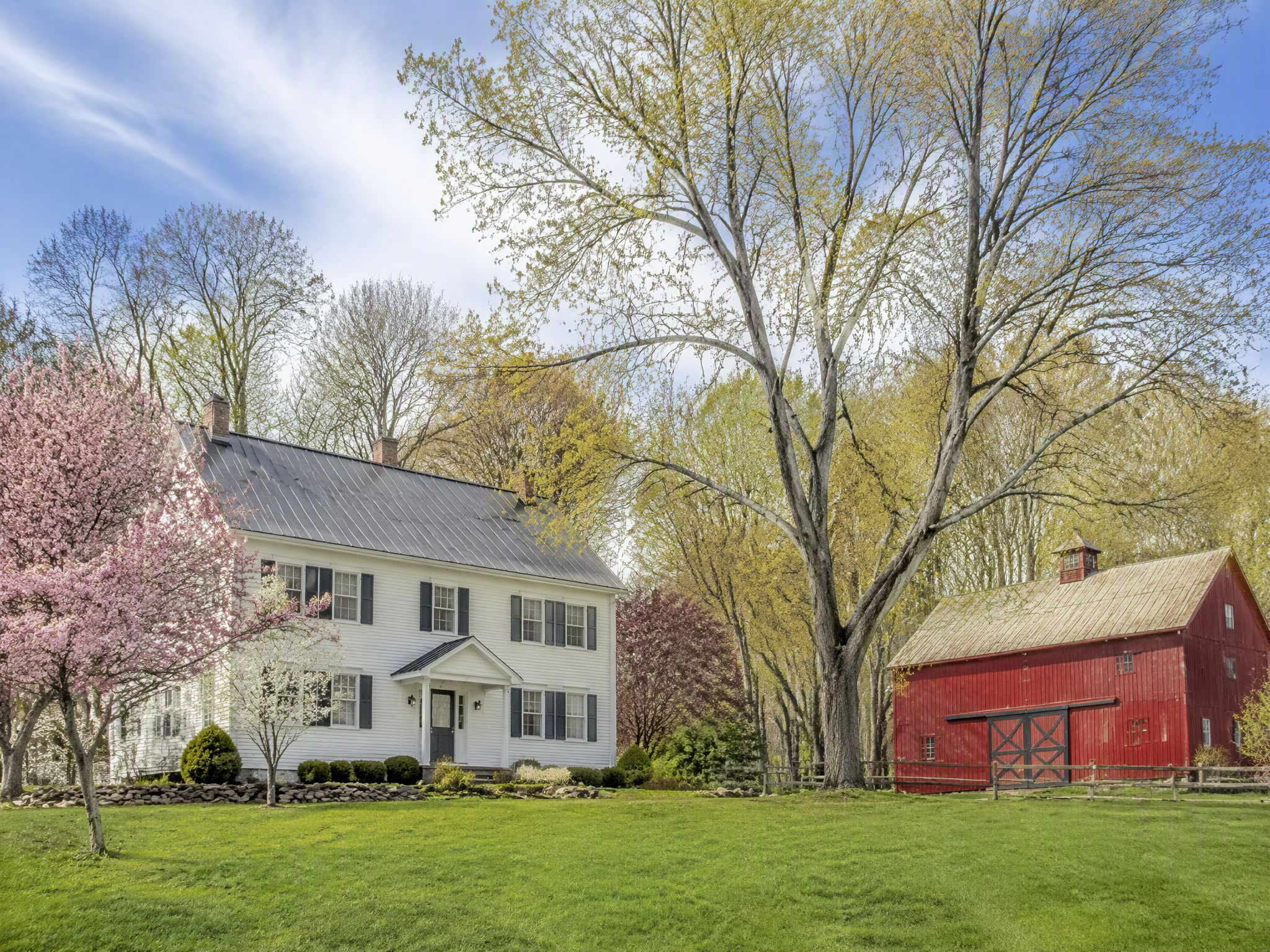 White farmhouse and red barn in Sussex County